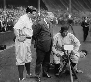 Typewriter Prints: Washington Senators Pitcher Nick Altrock at they typewriter while sitting on teammate Al Schact