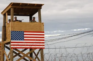 Cuba Prints: Watch tower security teams at Camp X-Ray man positions during a rehearsal for handling incoming detainees Jan
