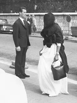Traditional Costume Prints: Wearing a dark veil, one of the wives of King Saud of Saudi Arabia enters the Hotel Negresco