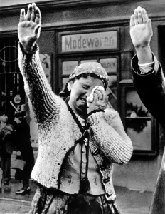 Lcgr1308 Prints: Weeping woman in the Sudetenland saluting the triumphant Hitler in 1938