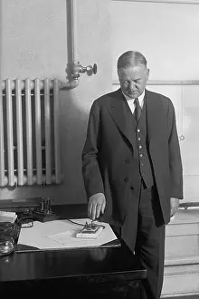 Button Prints: From the White House, President Herbert Hoover presses button to start machinery in new Detroit Times Building