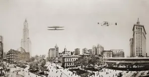 Aeronautics Prints: Wide angle panorama with two airplanes in flight over downtown Manhattan