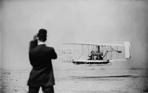 Wilbur Prints: Wilbur Wright 1867-1912 takes off for a flight over New York harbor on Sept. 29 1909