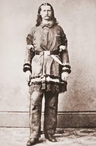 Crime Prints: Wild Bill Hickok portrait in buckskins with a large knife tucked into his belt. Ca. 1869