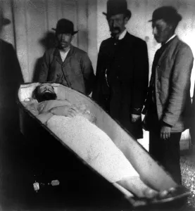 Mourner Prints: Wild West. Jesse James, dead, in coffin, ca. 1882