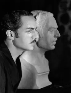 Profile Prints: William Powell with plaster bust to be used in Behind the Makeup, 1930