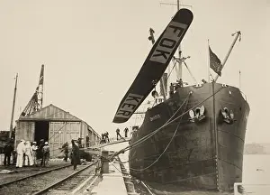 Boats Prints: The wing of a Fokker Tri-motor monoplane hoisted above the SS Chantier, May-June 1926