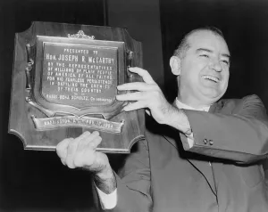 Awards Prints: Wisconsin Senator Joseph McCarthy displays a plaque honoring him