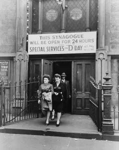 Fashions Prints: Wives and families of Jewish American GIs leave a New York City synagogue on West Twenty-third Street