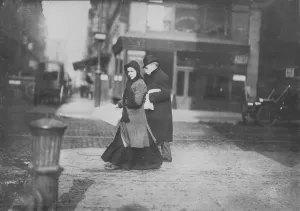 1910s Candid Prints: Woman carrying flowers home, West Houston Street