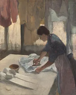 Woman Ironing, by Edgar Degas, 1878-87, French impressionist painting, oil on canvas. Degas was interested in laundresses movements, postures, and the rhythms of their work