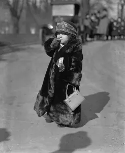 Purse Prints: Woman midget smoking a cigarette, wearing a fur coat, photograph circa January 23, 1924