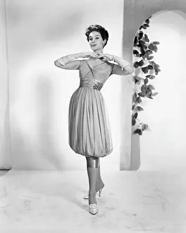 Evening Gloves Prints: A woman modeling 1950s fashion