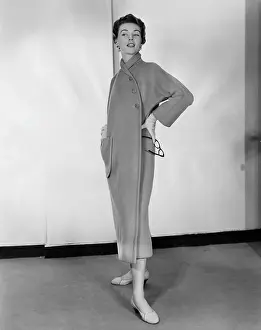 Coat Prints: A woman models a camel fleece coat designed by Claire McCardell