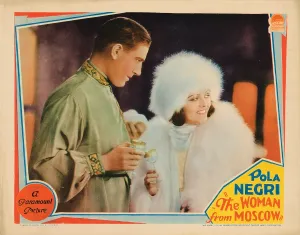 Fur Hat Prints: THE WOMAN FROM MOSCOW, lobbycard, from left: Paul Lukas, Pola Negri, 1928