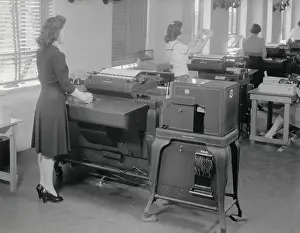 Automation Prints: A woman operates one of 12 IBM computers in use during the 1940 Census