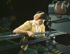 Machinery Prints: Woman operating a riveting machine on wing of B-17F heavy bombers during World War 2