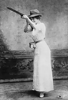 Hunters Prints: Woman posed with shotgun for trapshooting in 1914