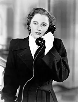Talking On Phone Prints: THE WOMAN IN RED, Barbara Stanwyck, 1935