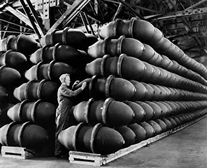 Bombs Prints: Woman war worker checks 1, 000 lb