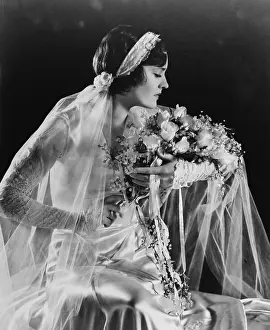 Lace Sleeves Prints: Woman in wedding gown, holding flowers, 1932. (BSLOC_2015_16_247)