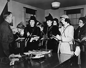 Interviews Prints: Women journalists taking notes in meeting with Brigadier General John Dahlquist