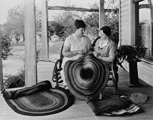 At Home Prints: Two women making rag rugs on porch, 1925-1930