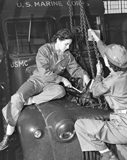 Overalls Prints: Women Marines lower a reconditioned engine back in place in a Marine Corps bus in 1943