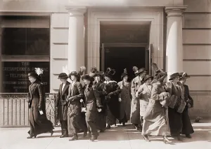 Office Workers Prints: Women workers leave the offices of the Chesapeake and Potomac Telephone Company. 1914