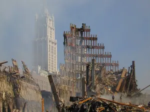 Fireman Prints: Woolworth Building rises behind the rubble of the collapsed North Tower of the WTC