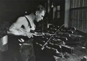 Young Man Prints: Worker building rubber dolls molds in Work Projects Administration (WPA) funded employment