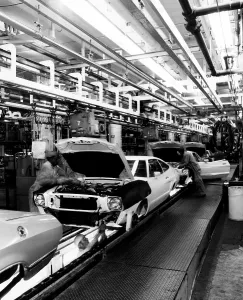 Automobile Prints: Workers assemble Ford Mustangs at the plant in Dearborn