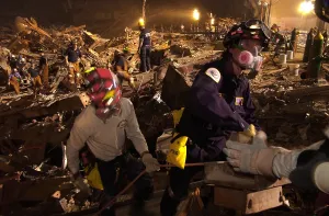 Skyscraper Prints: Workers lift rubble and search for survivors