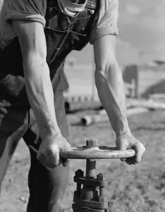 Muscles Prints: Workman opening valve on a new pipeline of Fort Loudoun Dam