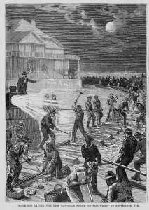 Images Dated 6th June 2012: Workmen laying the new railroad track on the night of September 5th. New Jersey, 1881