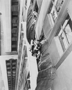 Lcgr1409 Prints: Workmen place a canvas over the hole between 78th and 79th floors of the Empire State Building