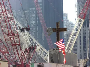 Rubble Prints: At the World Trade Center disaster site workers use heavy machinery to remove one of the steel beams from the section