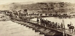 Africa Prints: World War 1 in Africa. British Empire artillery crossing a pontoon bridge across a stream