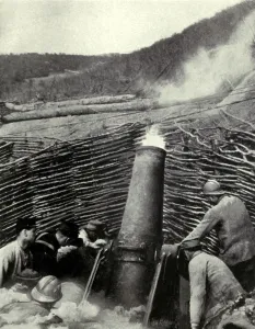 Attacks Prints: World War 1: Battle of Verdun. French mortar firing an eleven hundred pound shell over a hill into a German troops