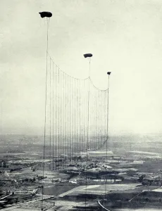 Aerial Bombing Prints: World War 1. British Barrage balloons dangle metal cables