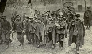 January Prints: World War 1. Defeated and wounded Russians limping into the courtyard of a German hospital in Dunajec