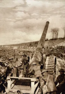 February Prints: World War 1. A group of soldiers operate modern artillery used by the British on the Somme