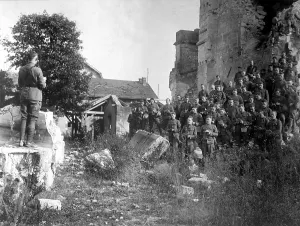 Minister Prints: World War I American soldiers of the 101st Field Signal Battalion at services in the ruins of a church destroyed by