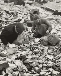 Images Dated 27th March 2008: World War II, two Germans searching for food in a garbage dump