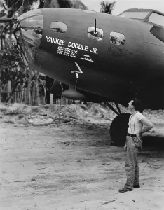 Admiring Prints: World War II, original caption: The Flying Fortress being admired here is the Yankee Doodle