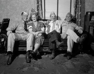 Parents Prints: World War II, party with soldier and sailor at the home of George Woolslayer