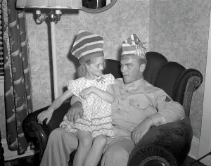 Sitting On Lap Prints: World War II, Proudly seated on Sergeant French L