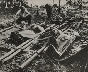 Medics Prints: Wounded American soldiers waiting for treatment and evacuation in crude stretchers in New Guinea during World War II