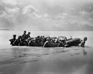 Lcgr1310 Prints: Wounded Marines in rubber boats are towed to larger vessels for transport to base hospitals