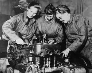 Labor Prints: WW1 era photo of three women engaged in auto engine repairs in Los Angeles